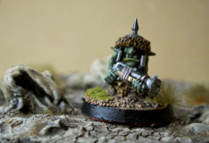 una Kakkola avanza tra le rocce, terreno e miniatura Games Workshop realizzati da giallinovagabondo